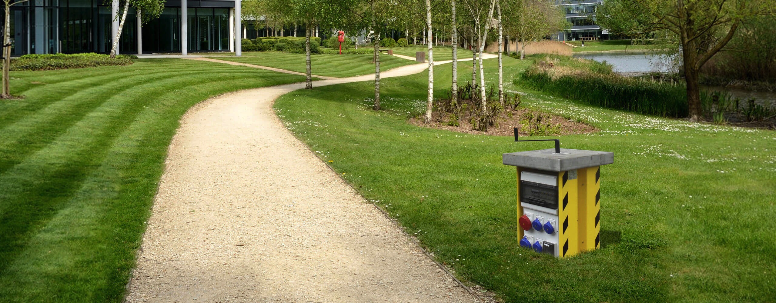 Pop up power unit outside an office building in a business park setting
